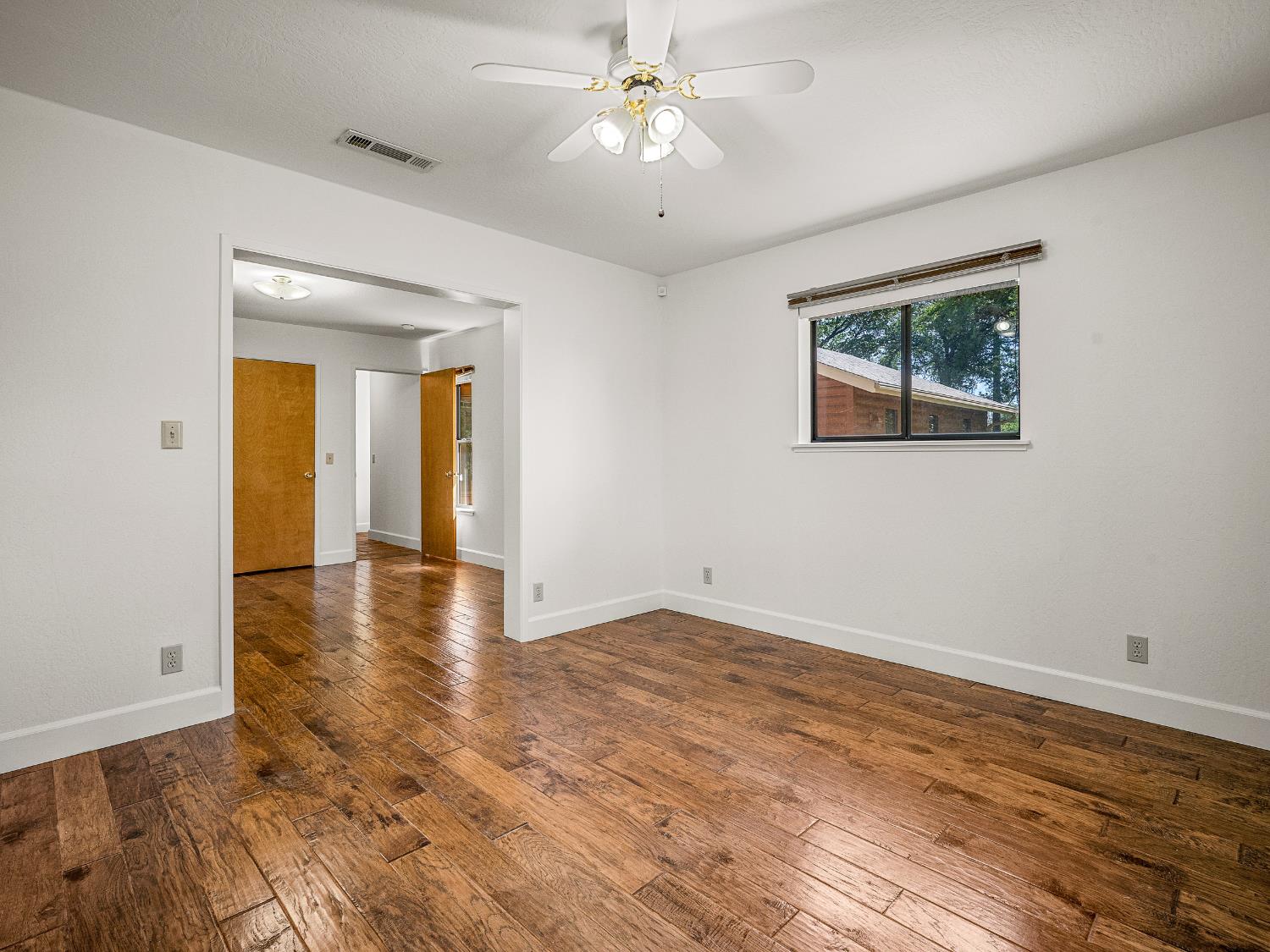 6460 Claim Street Placerville, CA 95667 - Photo 37 of 86 a view of an empty room with window and wooden floor