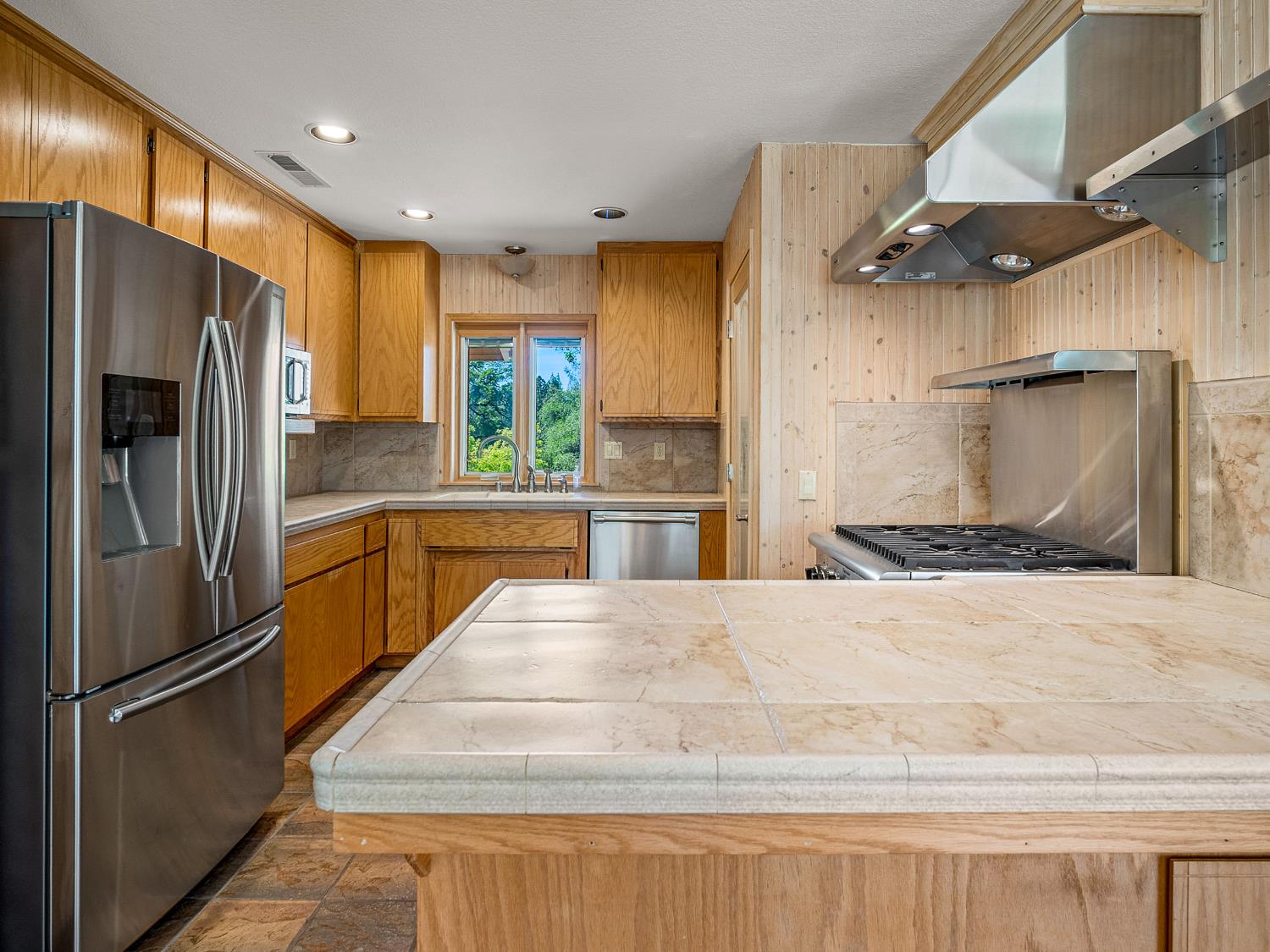 6460 Claim Street Placerville, CA 95667 - Photo 49 of 86 a kitchen with stainless steel appliances a refrigerator and a sink