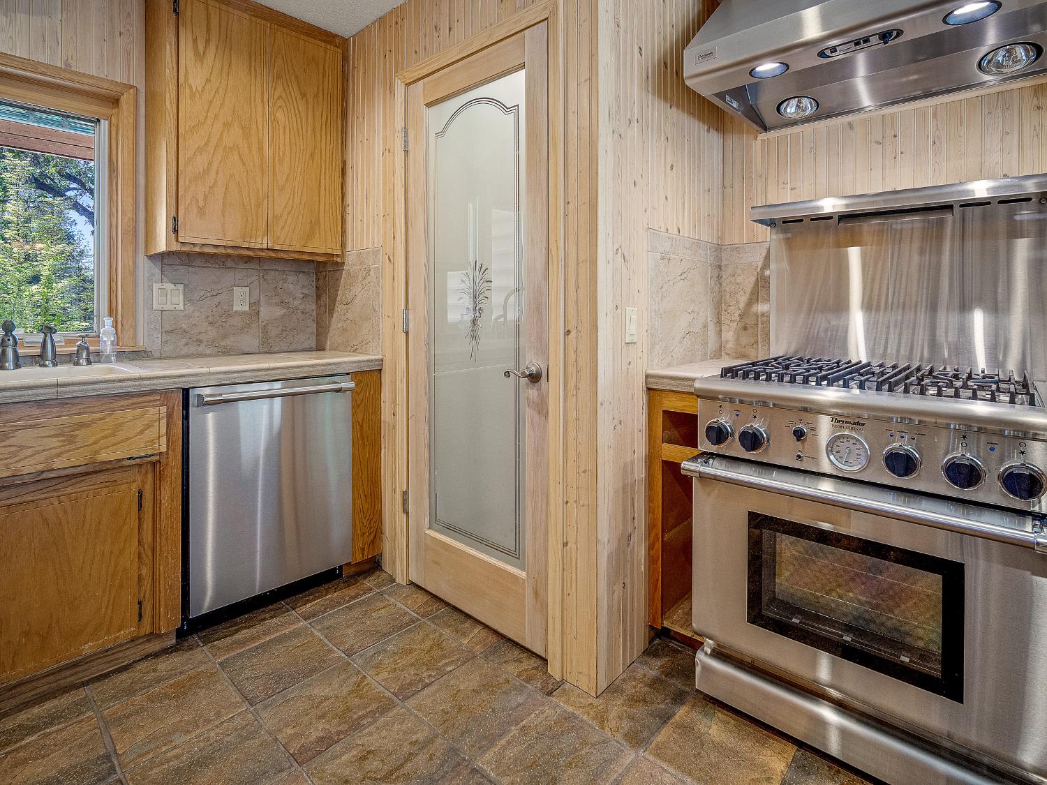 6460 Claim Street Placerville, CA 95667 - Photo 50 of 86 a stove top oven sitting inside of a kitchen
