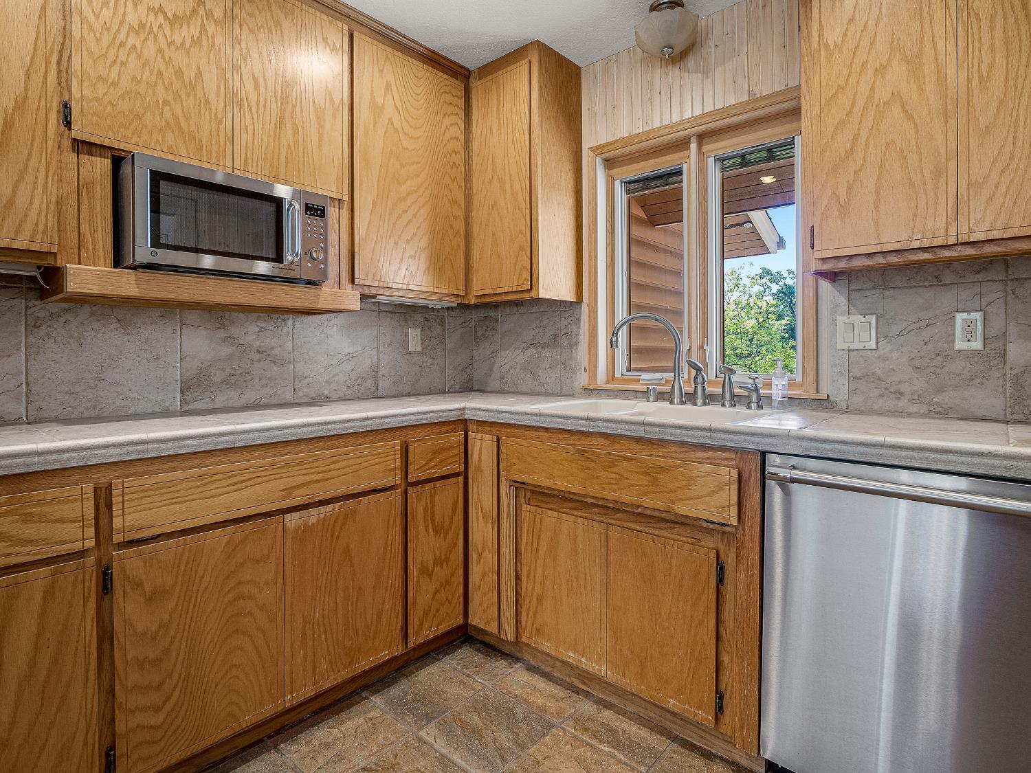 6460 Claim Street Placerville, CA 95667 - Photo 51 of 86 a kitchen with stainless steel appliances granite countertop cabinets and a microwave oven