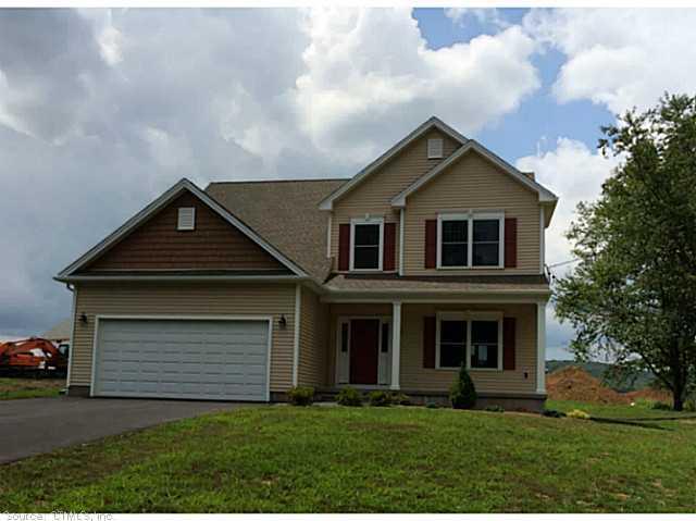 Lot#4 Higby Road Middletown, CT 06457 - Photo 1 of 1 a front view of a house with a yard and garage