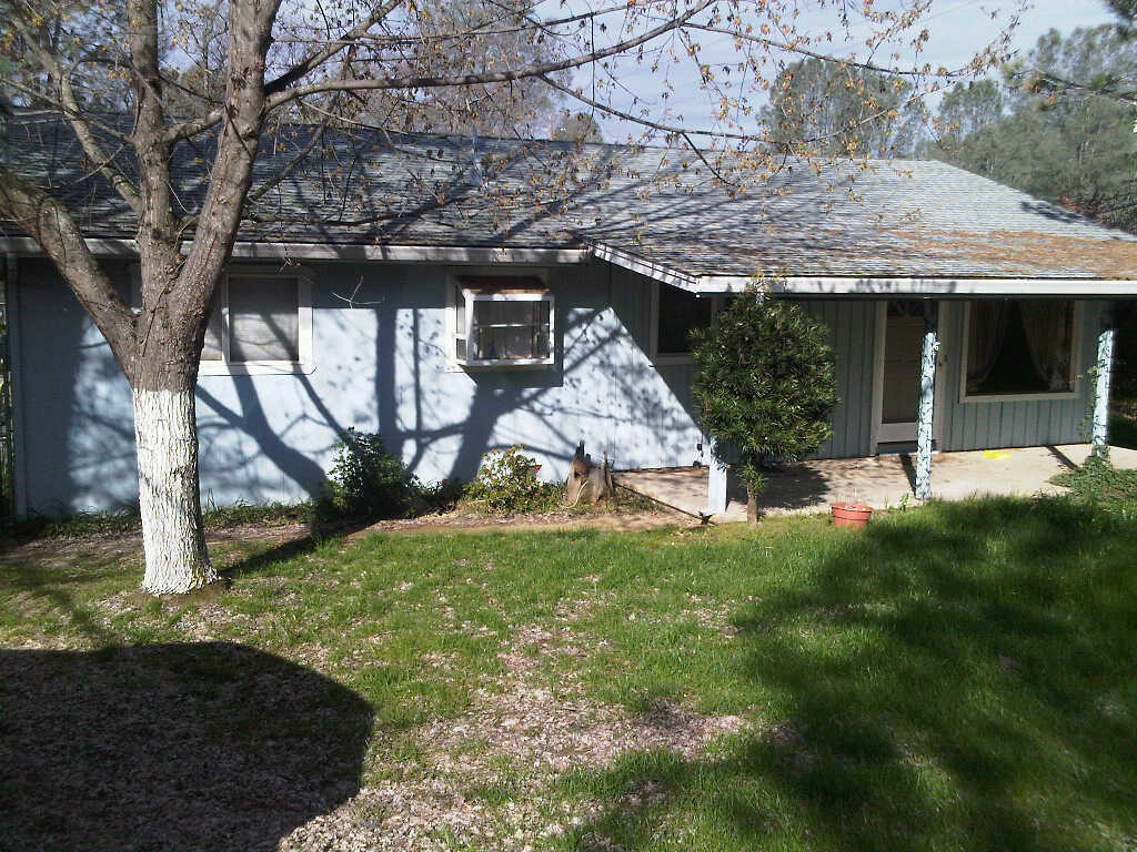 3131 Keswick Dam Road Redding, CA 96003 - Photo 1 of 3 a view of a house with backyard and sitting area