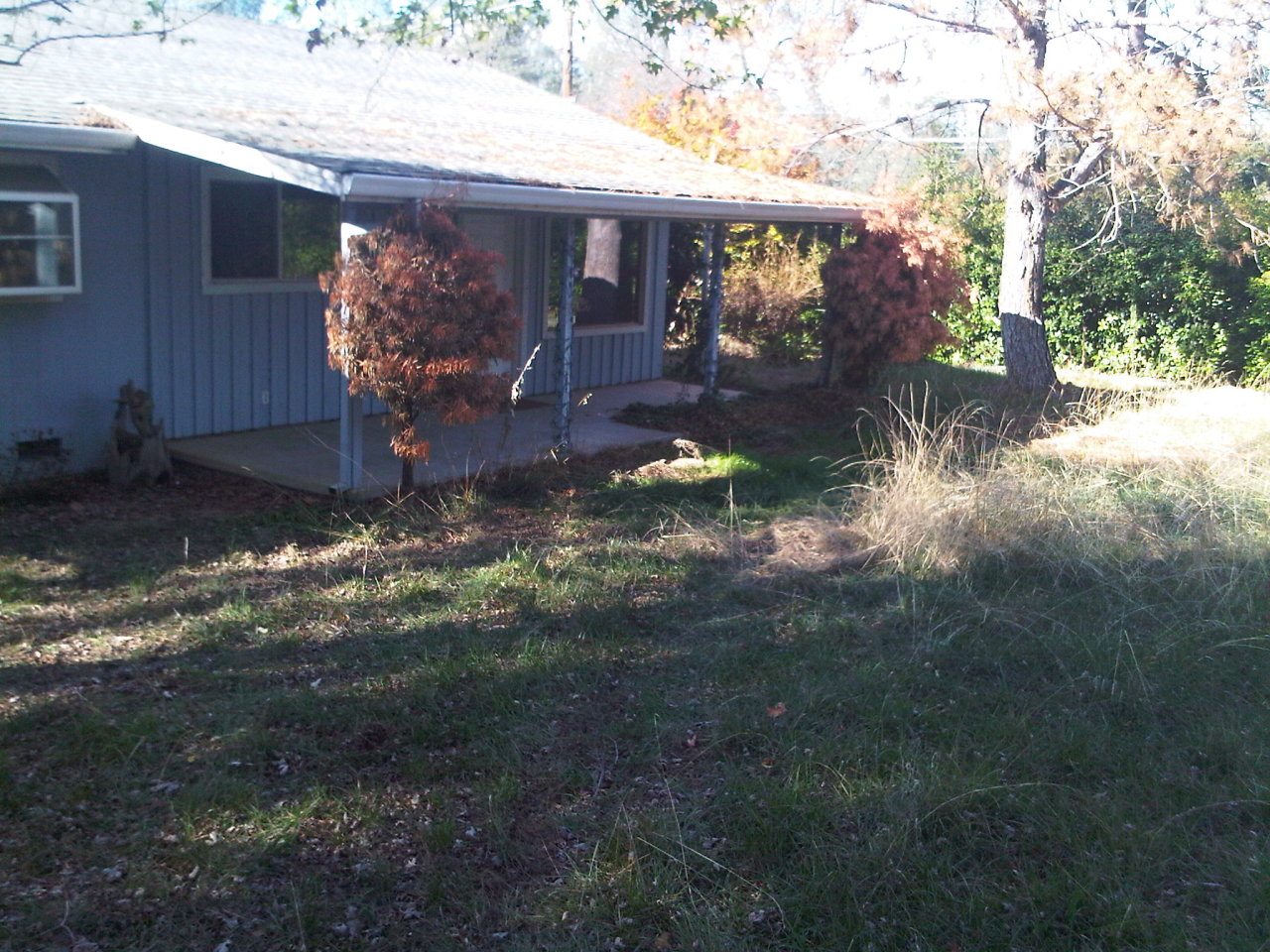 3131 Keswick Dam Road Redding, CA 96003 - Photo 2 of 3 a front view of a house with garden