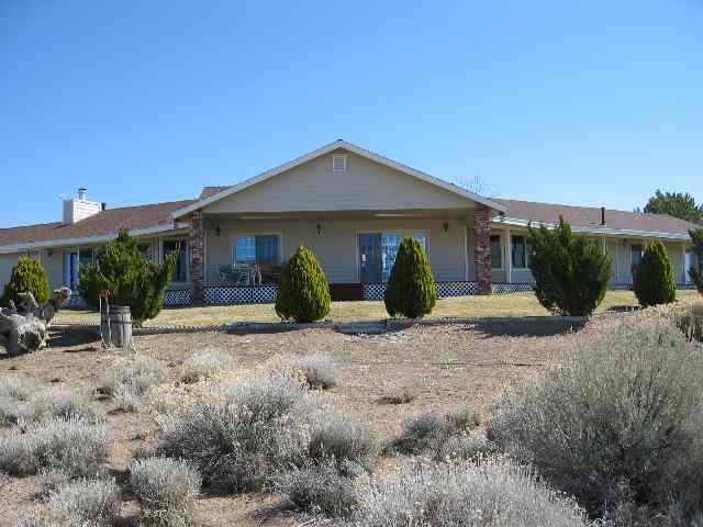 1530 Lombardy Road Gardnerville, NV 89410 - Photo 3 of 3 a view of a house with backyard and plants