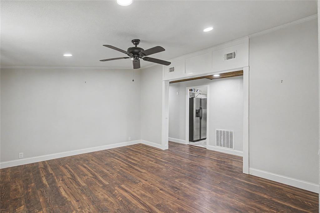 1701 Central Road Weatherford, TX 76088 - Photo 10 of 40 Living room with a ceiling fan, recessed lighting, dark wood-style floors, and crown molding