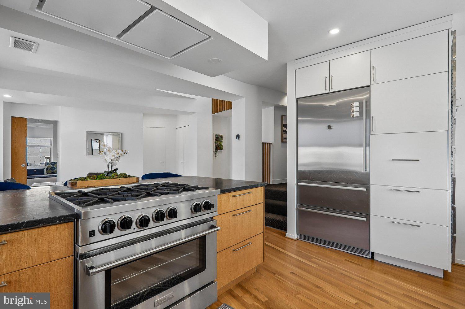 2370 Champlain Street Northwest, Unit 35 Washington, DC 20009 - Photo 12 of 49 a kitchen with granite countertop a stove and a refrigerator