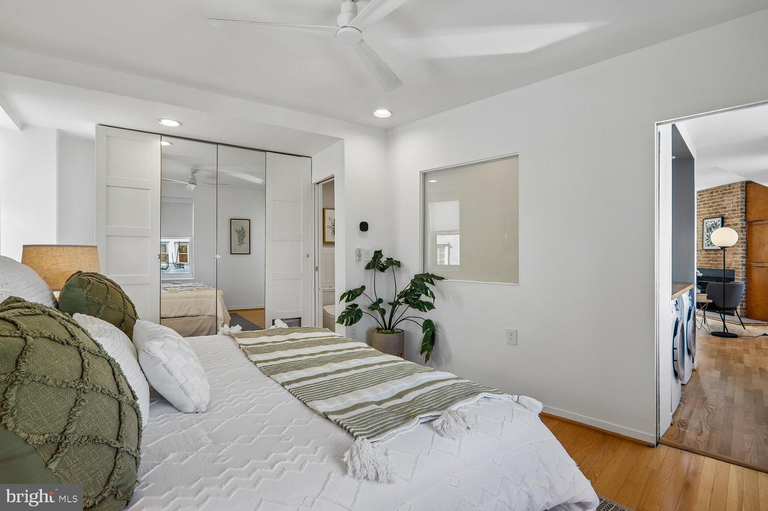 2370 Champlain Street Northwest, Unit 35 Washington, DC 20009 - Photo 28 of 49 a bedroom with a bed and a chandelier