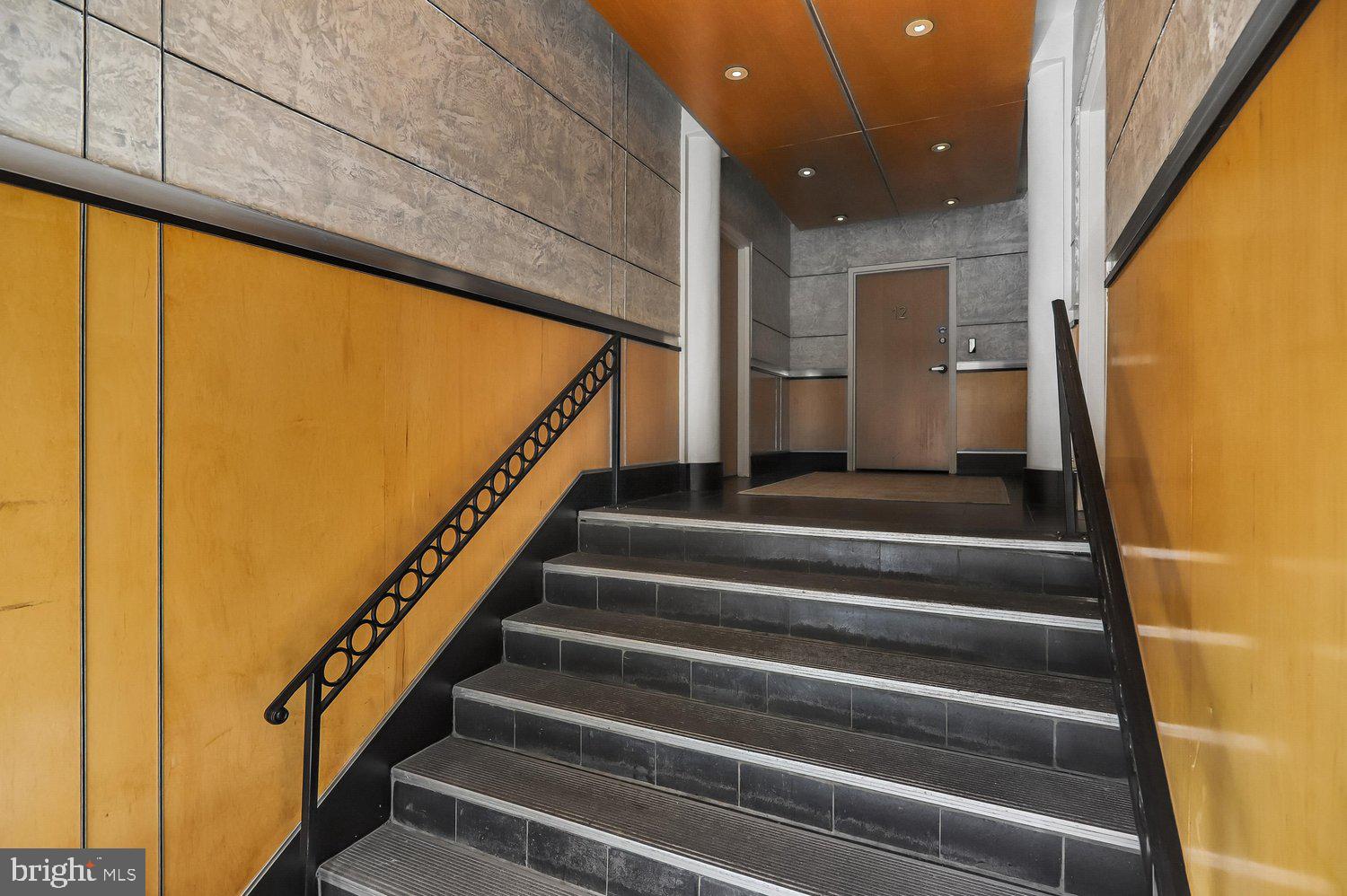 2370 Champlain Street Northwest, Unit 35 Washington, DC 20009 - Photo 34 of 49 a view of entryway with wooden floor and stairs