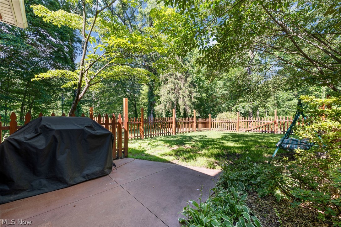 10400 Stoneacre Road Northwest Canal Fulton, OH 44614 - Photo 34 of 44 Fenced backyard featuring grilling area and a patio