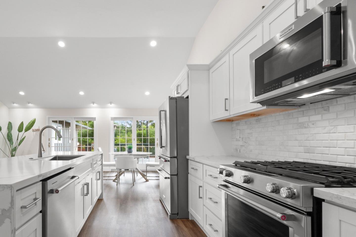 770 Graham Hill Road Santa Cruz, CA 95060 - Photo 26 of 83 a kitchen with stainless steel appliances a stove a sink and a microwave