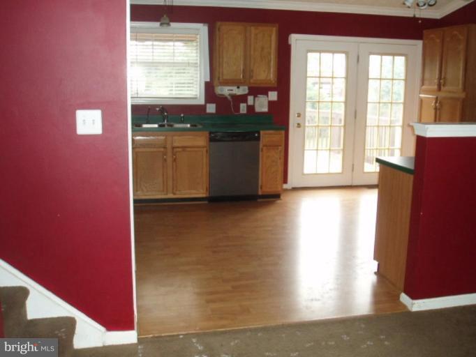 89 Cottontail Court Ranson, WV 25438 - Photo 3 of 9 a kitchen with stainless steel appliances granite countertop a refrigerator and a sink