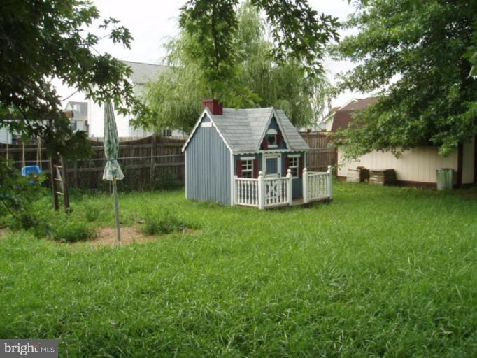 89 Cottontail Court Ranson, WV 25438 - Photo 4 of 9 a view of a house with backyard and a tree