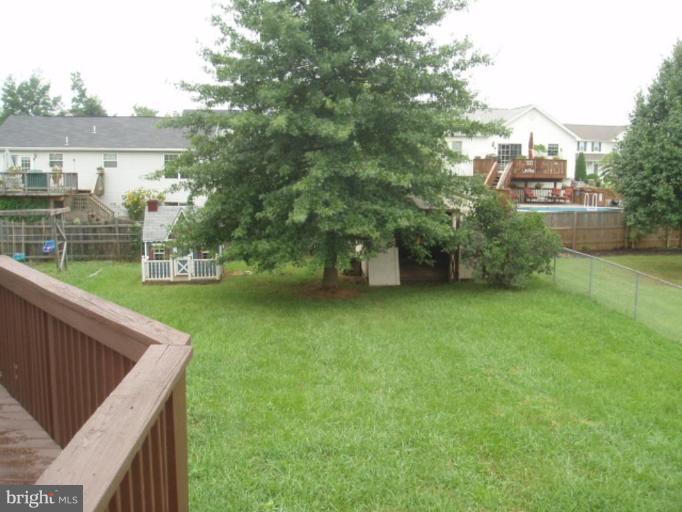 89 Cottontail Court Ranson, WV 25438 - Photo 5 of 9 a view of a backyard with a garden and plants