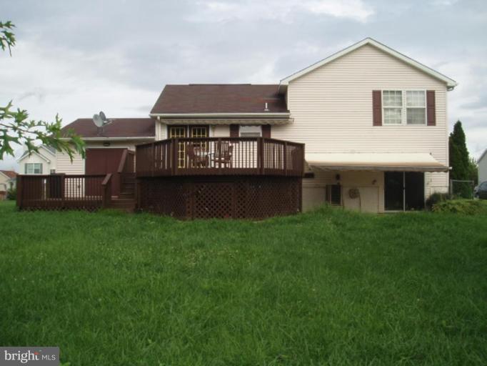 89 Cottontail Court Ranson, WV 25438 - Photo 8 of 9 a front view of a house with a garden