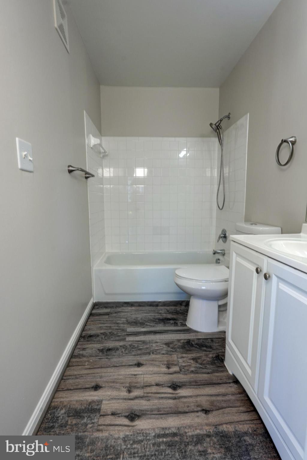 1001 Gaither Road, Unit I Rockville, MD 20850 - Photo 24 of 34 a bathroom with a sink toilet and shower