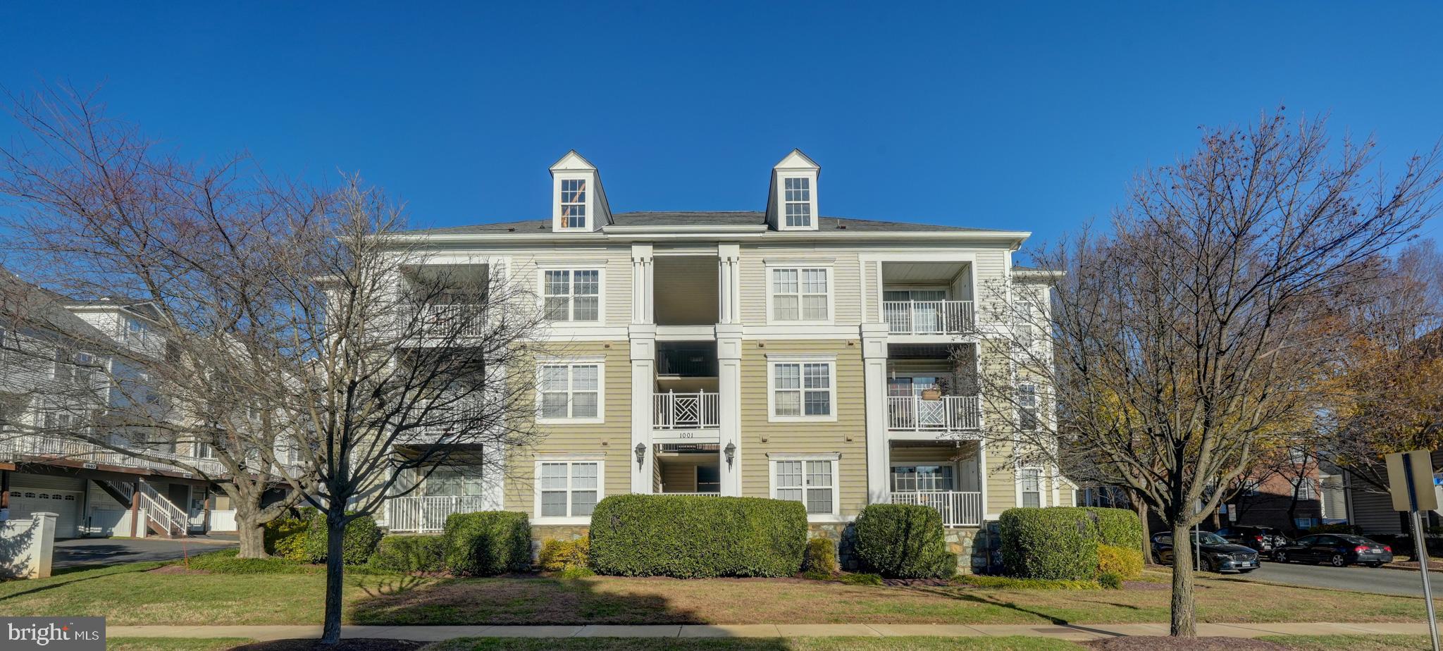 1001 Gaither Road, Unit I Rockville, MD 20850 - Photo 32 of 34 a front view of a building with a yard