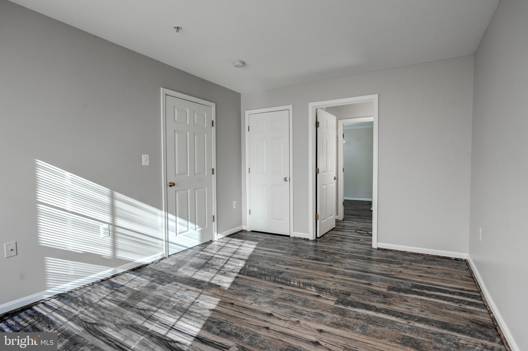 1001 Gaither Road, Unit I Rockville, MD 20850 - Photo 8 of 34 a view of a room with wooden floor