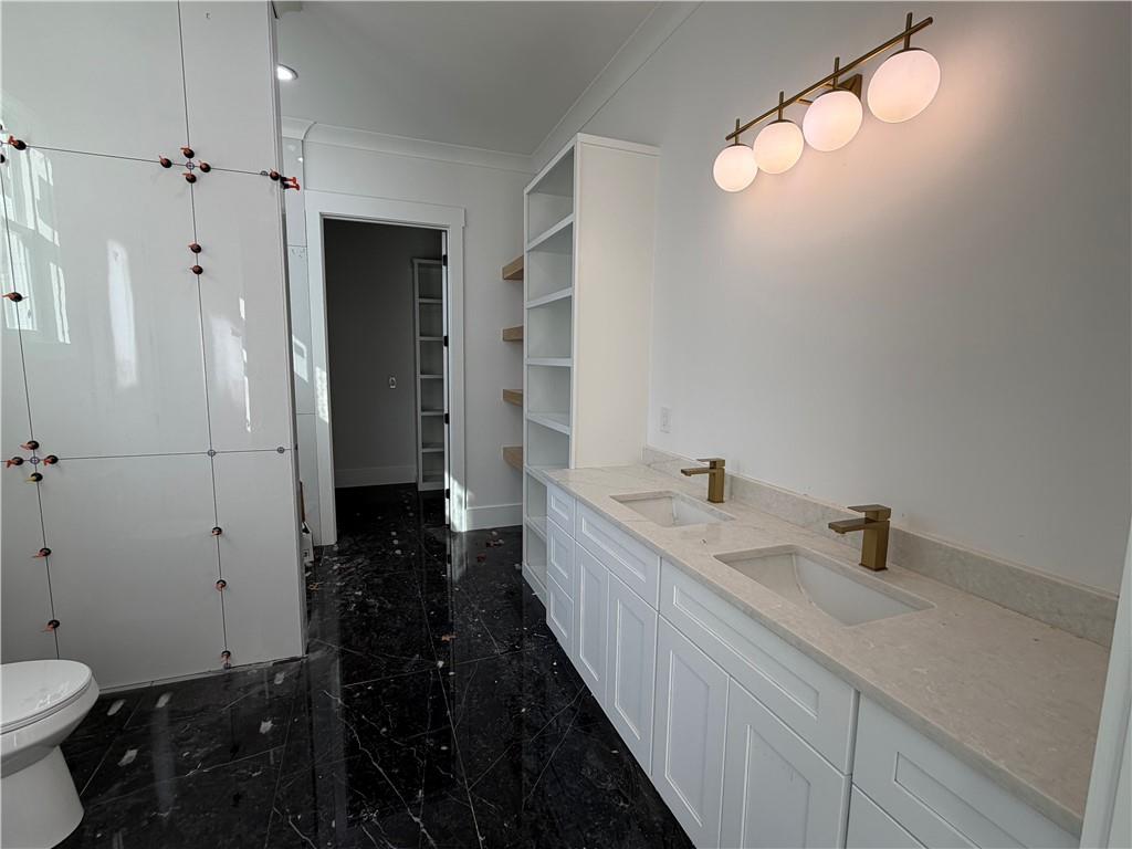 2596 Camp Mitchell Road Grayson, GA 30017 - Photo 14 of 19 a bathroom with a sink and a mirror