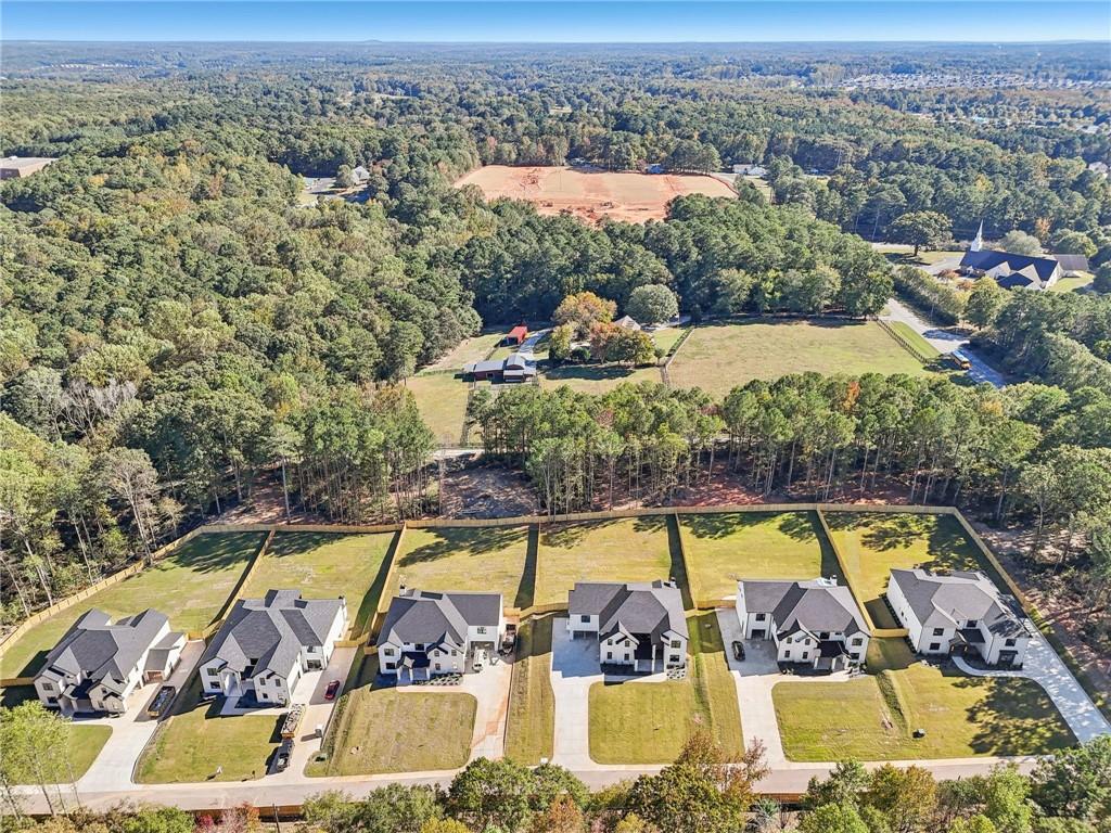 2596 Camp Mitchell Road Grayson, GA 30017 - Photo 16 of 19 an aerial view of swimming pool with outdoor seating and yard