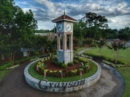 2596 Camp Mitchell Road Grayson, GA 30017 - Photo 17 of 19 a view of a house with a small yard and a fountain