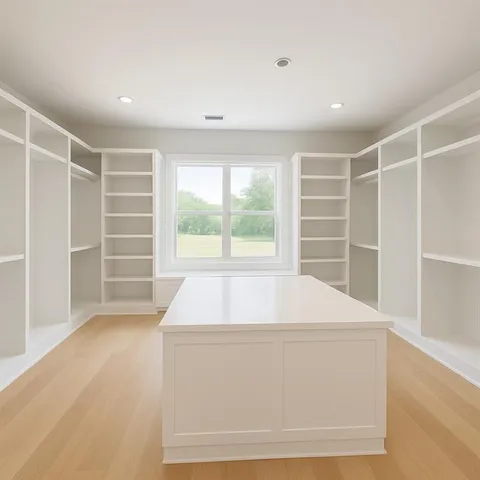 a view of room with wooden floor and windows