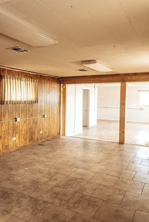 a view of an empty room with a window
