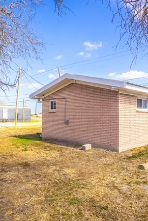 a view of a house with a backyard