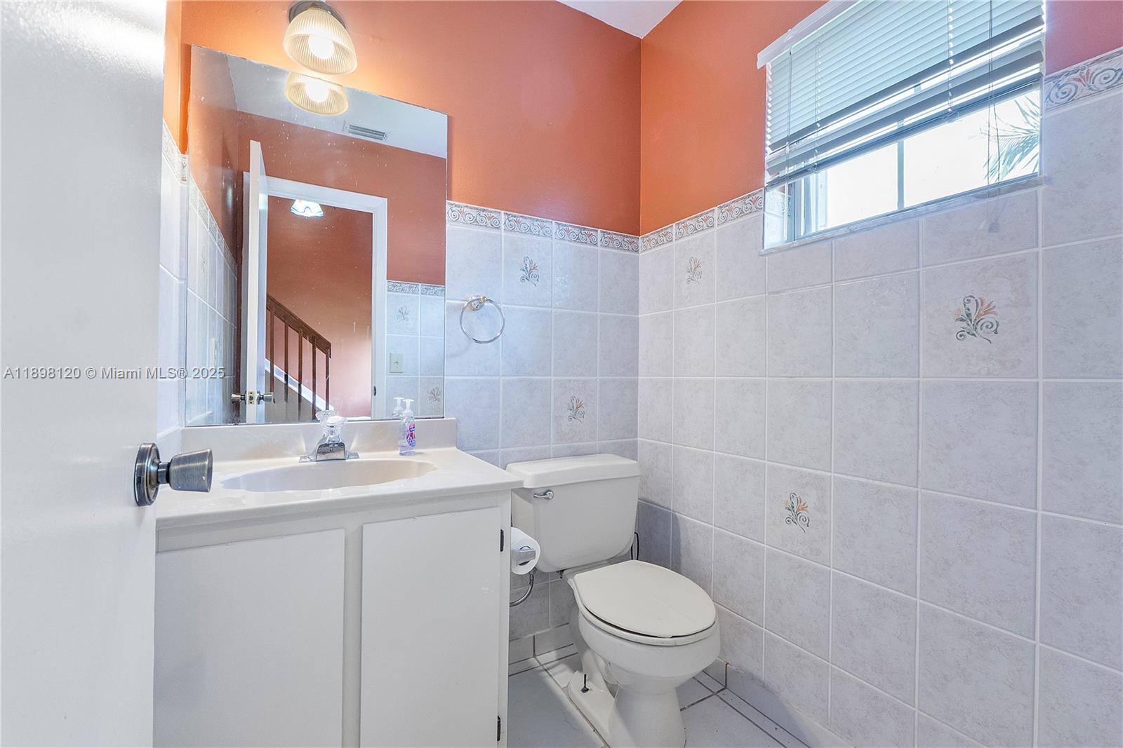 9870 Northwest 2nd Street Plantation, FL 33324 - Photo 6 of 12 a bathroom with a sink a toilet and shower