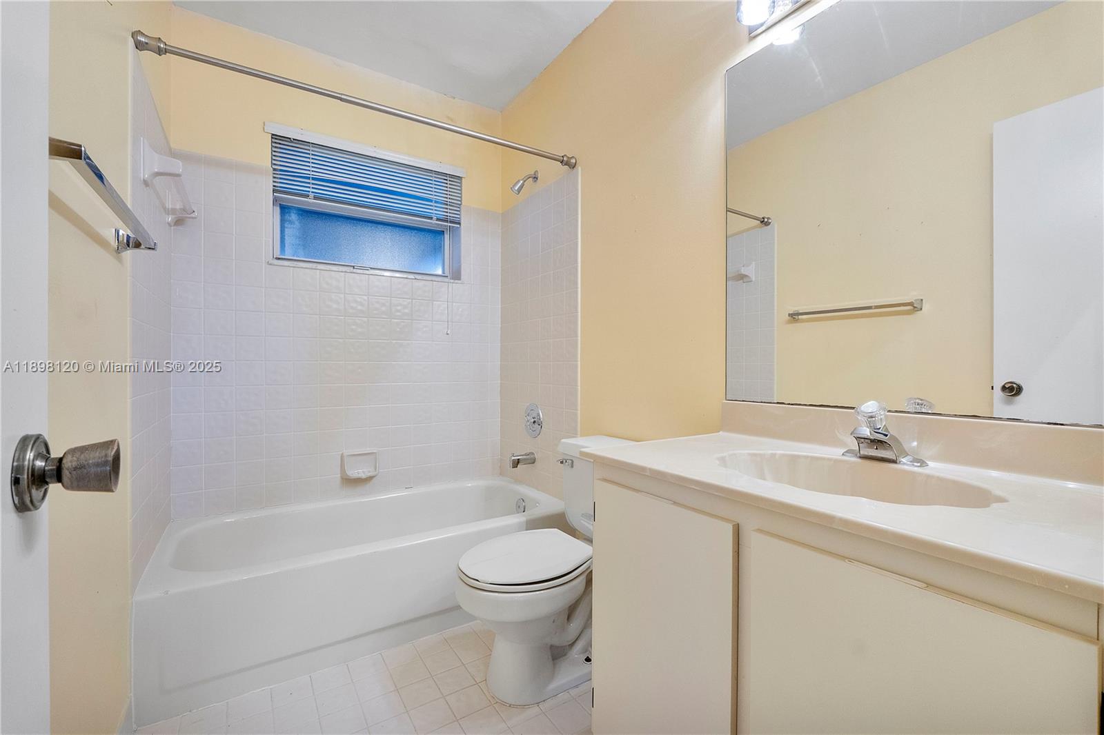 9870 Northwest 2nd Street Plantation, FL 33324 - Photo 10 of 12 a bathroom with a sink a toilet and shower