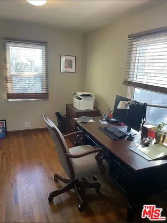 a workspace with furniture and window