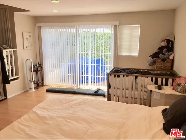 a view of a living room and a balcony