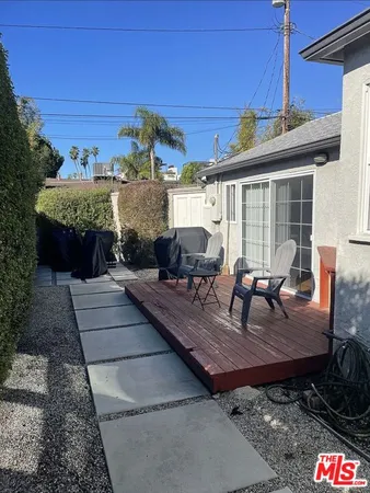 a view of a couches and dinning table in patio