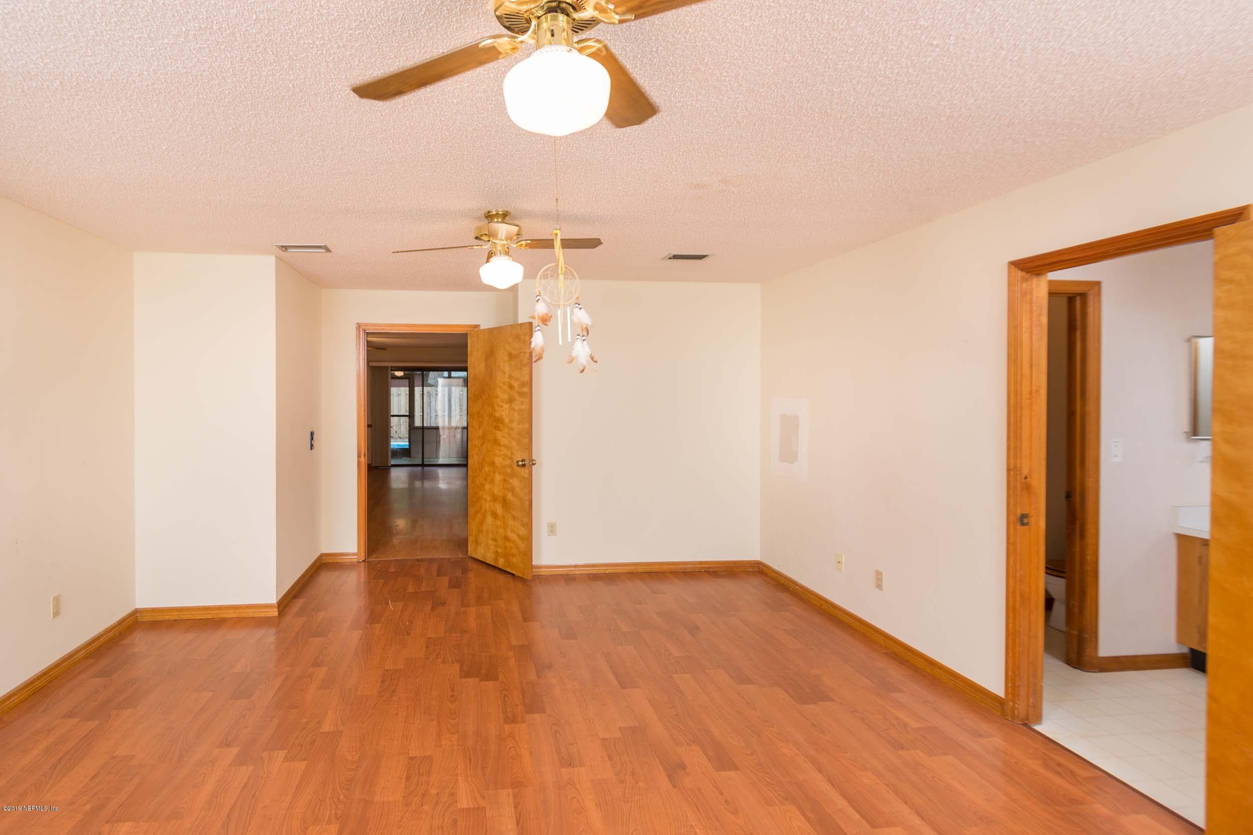 702 Miranda Road St. Augustine, FL 32086 - Photo 21 of 37 a view of a room with wooden floor