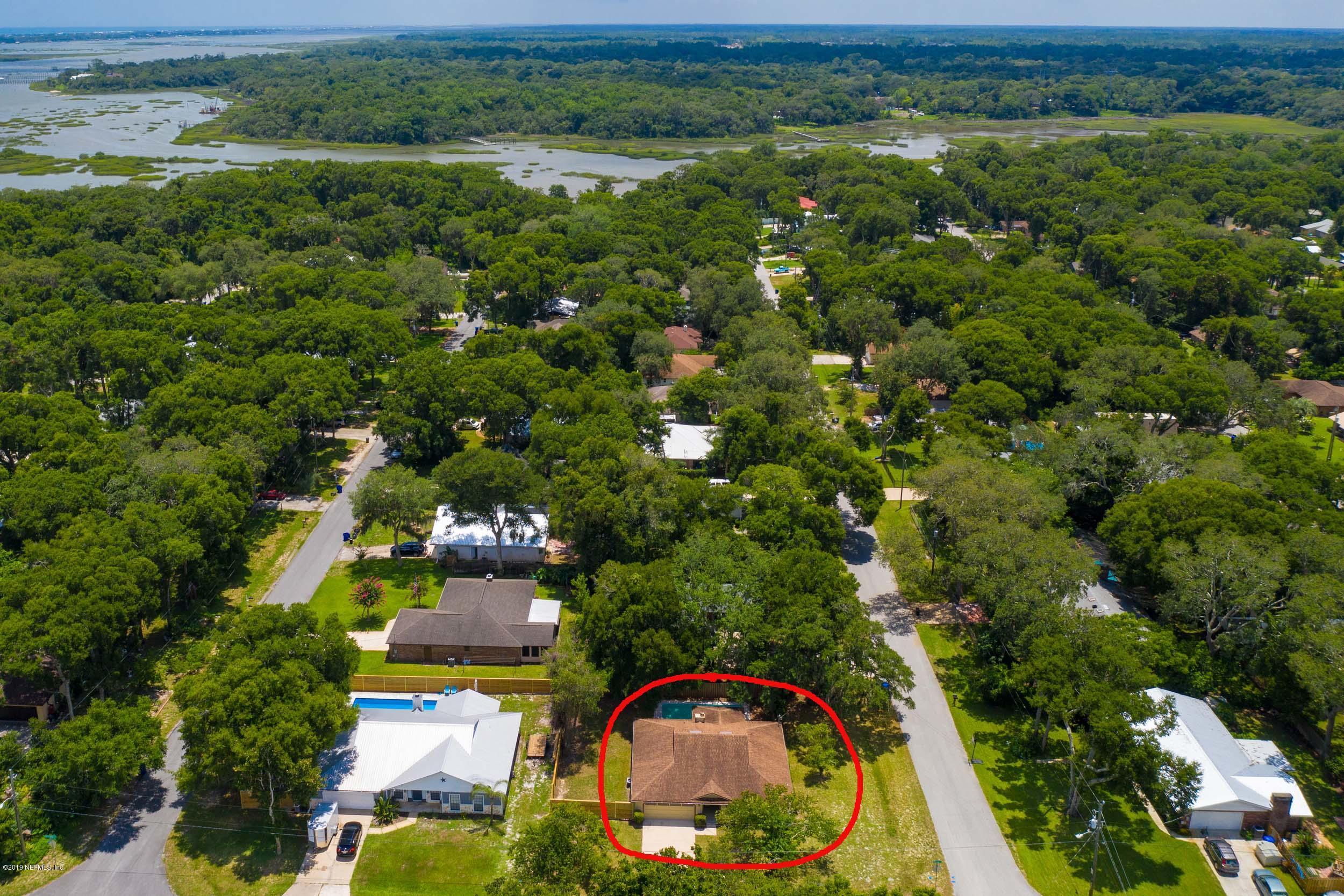 702 Miranda Road St. Augustine, FL 32086 - Photo 5 of 37 an aerial view of a house with a yard and lake view