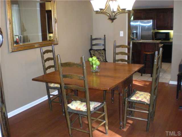 3417 Hackney Court Raleigh, NC 27613 - Photo 6 of 23 Spacious formal dining room with beautiful hardwoods & updated light fixture. Located next to kitchen & doorway to deck for easy entertaining.