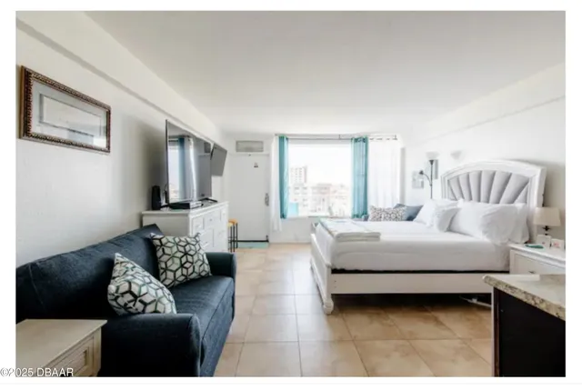a room with cabinets and flat screen tv