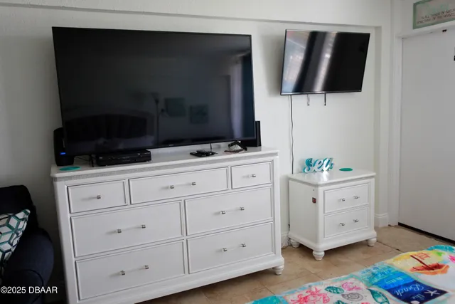 a room with furniture and flat screen tv