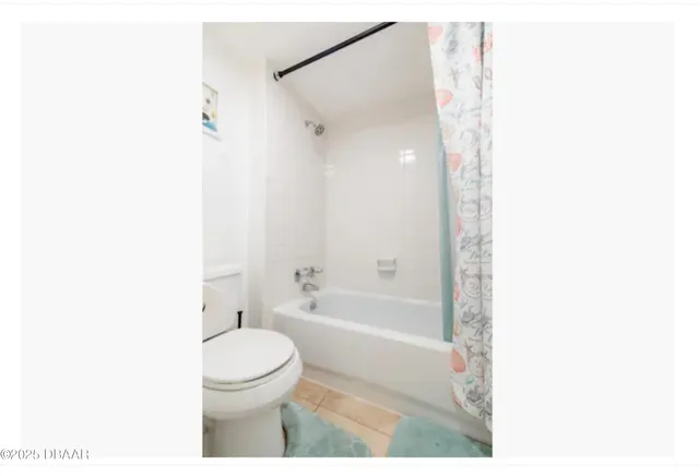 a view of a table and chairs under an umbrella