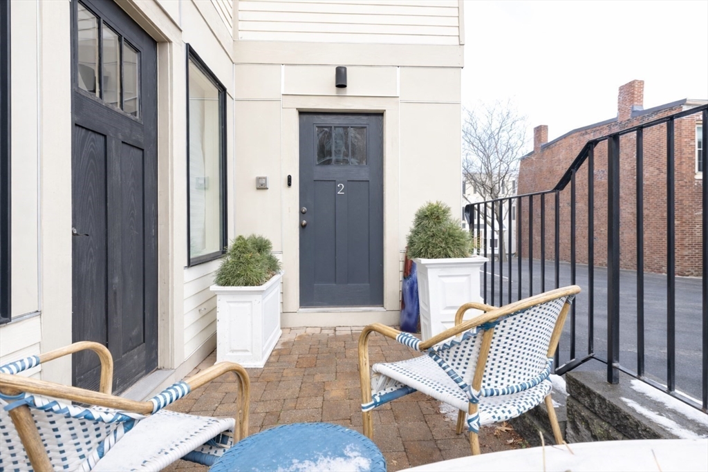 435 East 3rd Street, Unit 2 Boston, MA 02127 - Photo 22 of 24 a view of a balcony with two chairs and a potted plant
