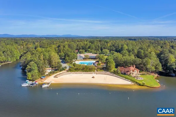 a view of a swimming pool with a lake view