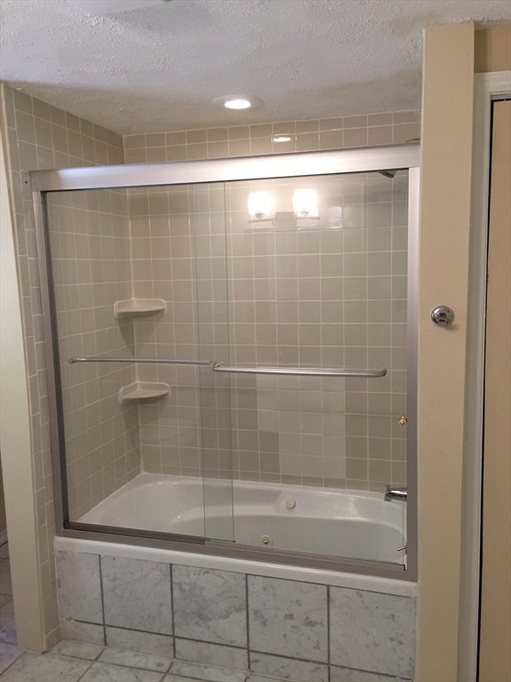 31 Pine Street Dedham, MA 02026 - Photo 10 of 11 a bathroom with a shower