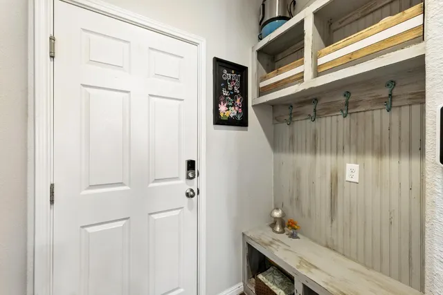 a bedroom with a bed couch and a window