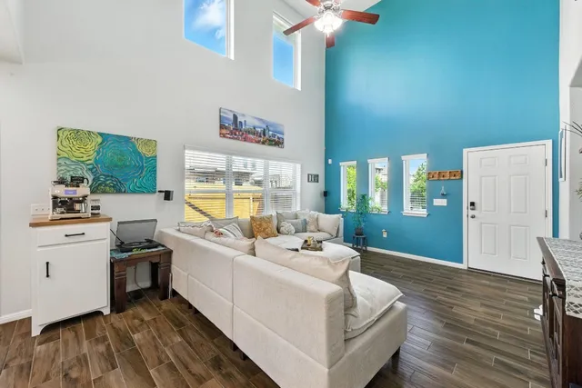 a living room with furniture and a large window