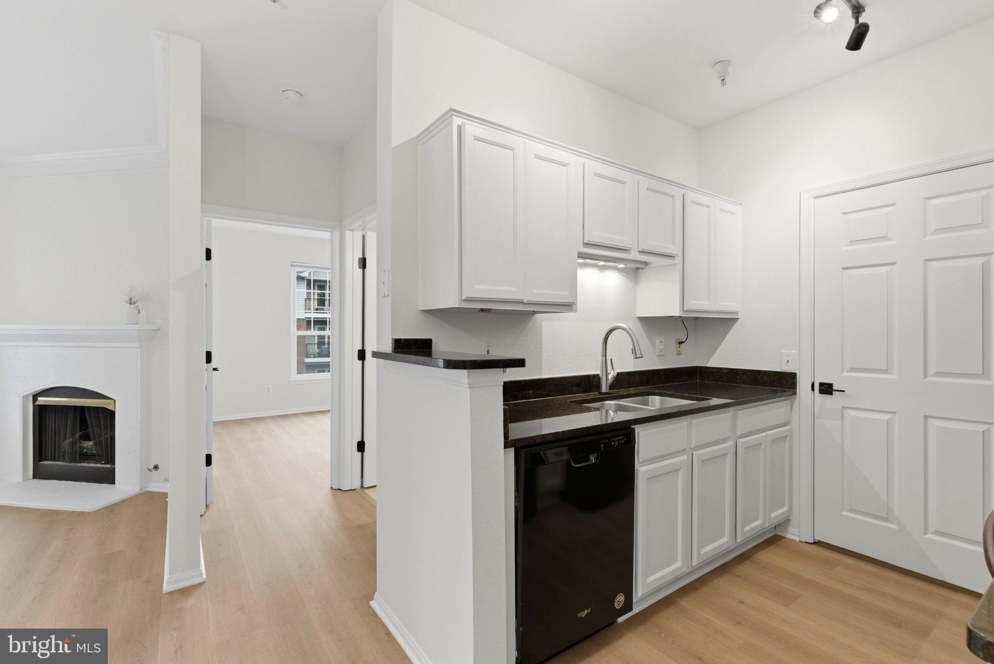1580 Spring Gate Dr., Unit 4303 McLean, VA 22102 - Photo 7 of 41 Modern kitchen with sleek finishes.