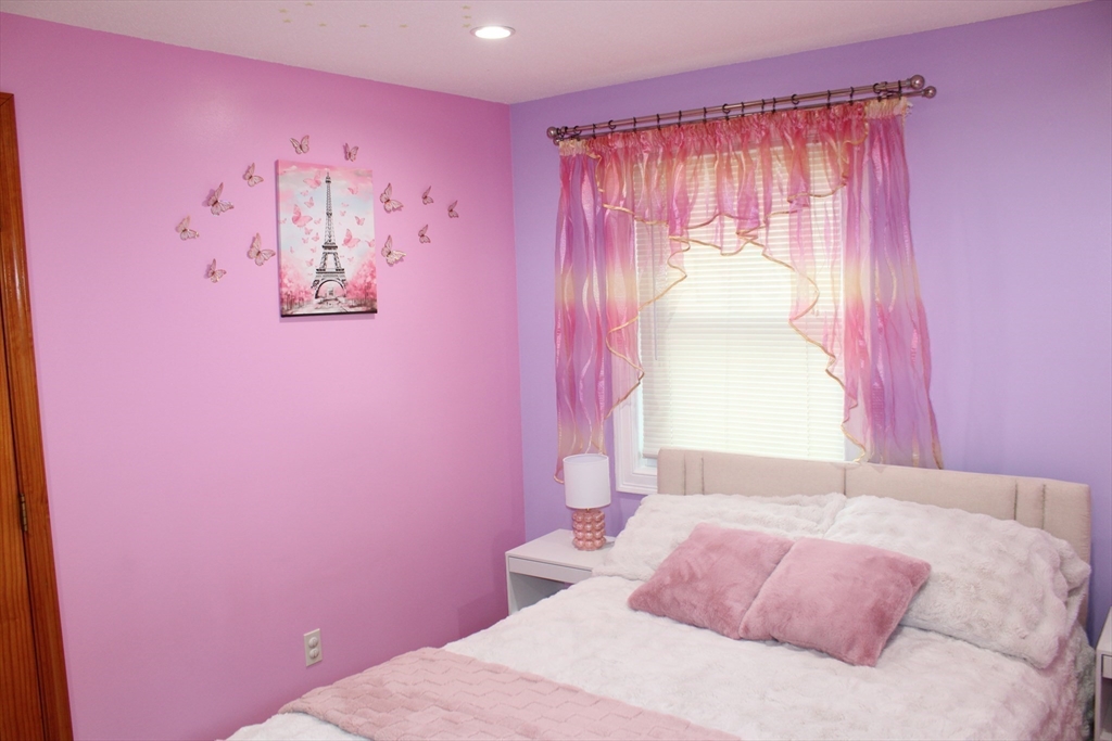28 State Street Chicopee, MA 01013 - Photo 17 of 25 a bedroom with a bed and a window