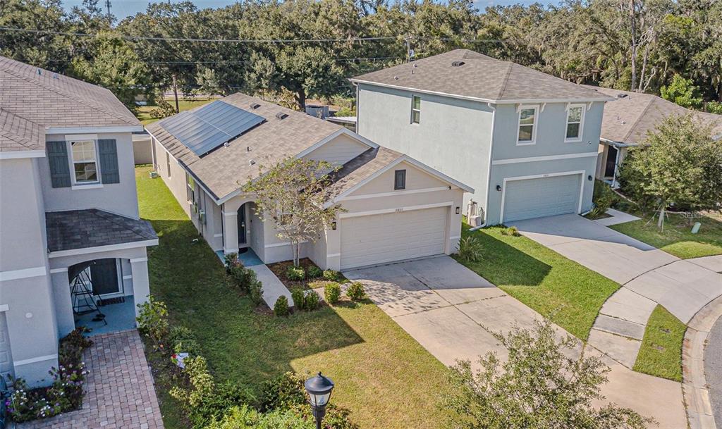 10853 Trailing Vine Drive Tampa, FL 33610 - Photo 5 of 15 a aerial view of a house next to a yard