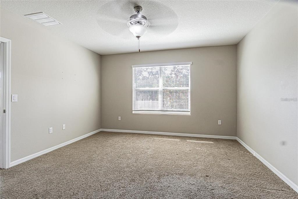 10853 Trailing Vine Drive Tampa, FL 33610 - Photo 9 of 15 an empty room with a window