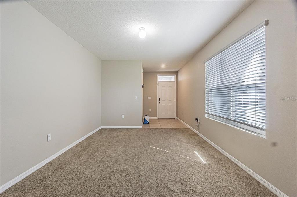 10853 Trailing Vine Drive Tampa, FL 33610 - Photo 10 of 15 an empty room with a window