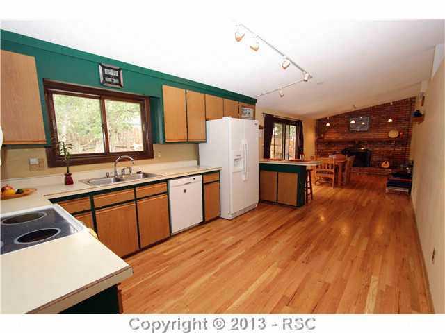 2720 Rigel Drive Colorado Springs, CO 80906 - Photo 4 of 19 Kitchen with Dining Room