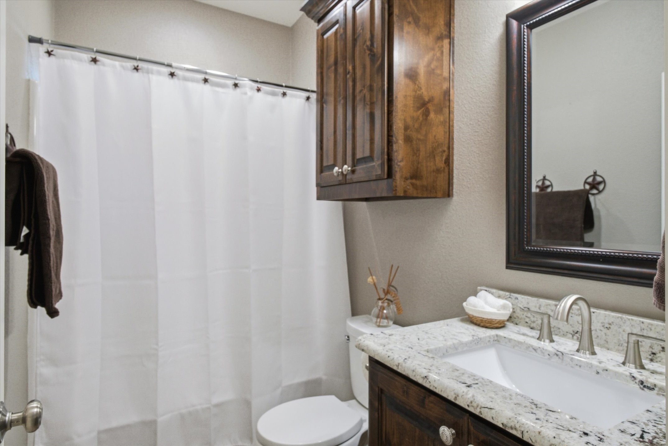 271 Rscr 4269 Emory, TX 75440 - Photo 11 of 48 a bathroom with a granite countertop sink and a mirror
